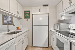 Coffee/tea maker, fridge, microwave, oven