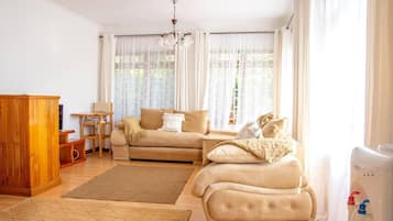 Cottage | Living area | 30-inch TV with cable channels