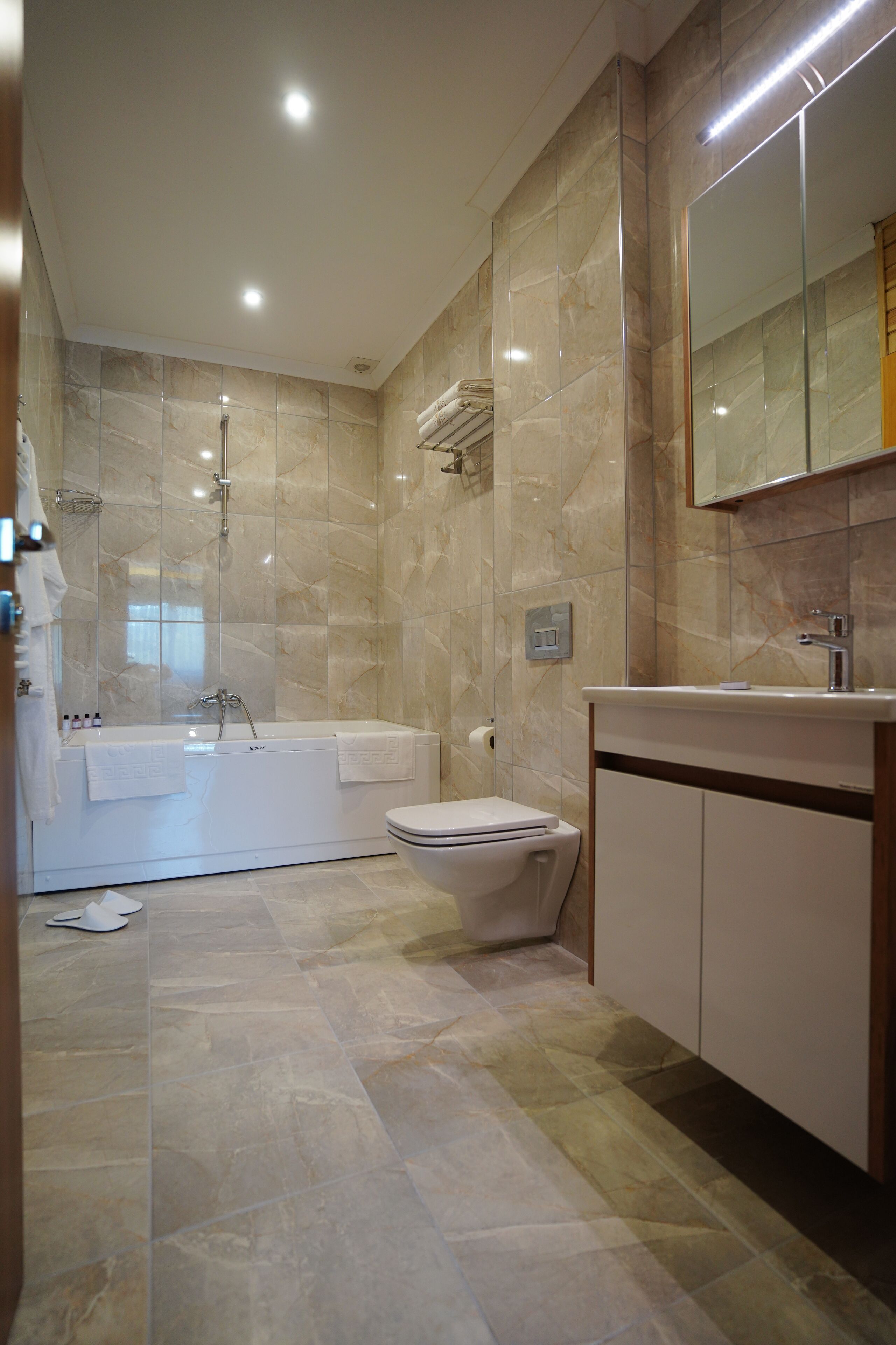 hair dryer, slippers, towels