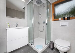 Bathtub, hair dryer, towels, soap