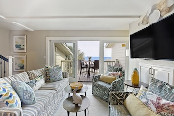 Imaging relaxing in this spacious living room with ocean views