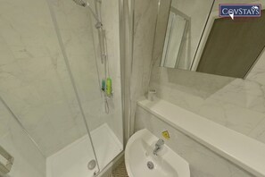 Shower, towels, soap, toilet paper