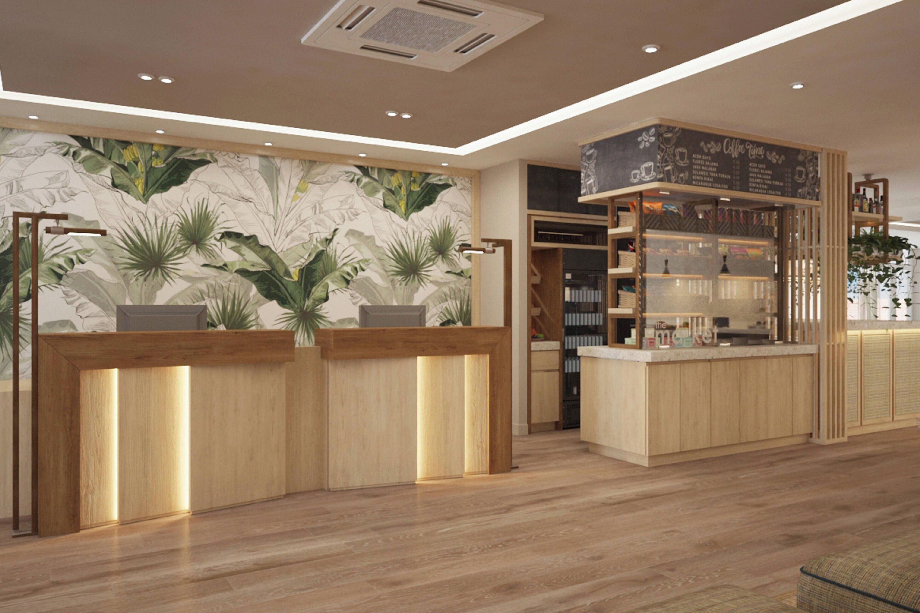 A reception area with wooden counters, a wall with a tropical leaf mural, and a coffee station with a chalkboard menu.