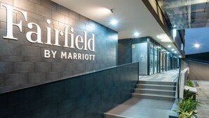 A modern hotel entrance with a prominent sign reading "Fairfield by Marriott" and a staircase leading to the lobby. - Fairfield by Marriott Medellin Sabaneta (Sabaneta)