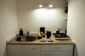 Surface de cuisson, cafetière-théière