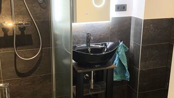 Design Condo | Bathroom | Hair dryer, towels, soap, shampoo