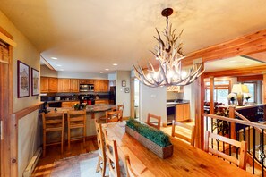 Enjoy a well-appointed kitchen with a central island, modern range hood, and microwave.