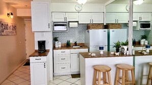 Coffee/tea maker, fridge, microwave, oven