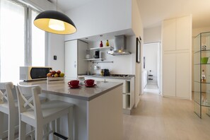 Deluxe Apartment, 1 Bedroom | Living area | 43-inch TV with digital channels