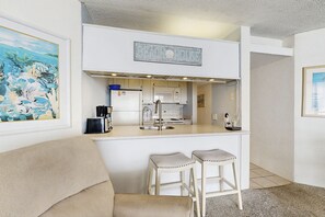 Fridge, microwave, oven, stovetop - Oceanfront Condo with a Shaded Balcony, AC, WiFi, Laundry & Shared Pool (Ocean City)