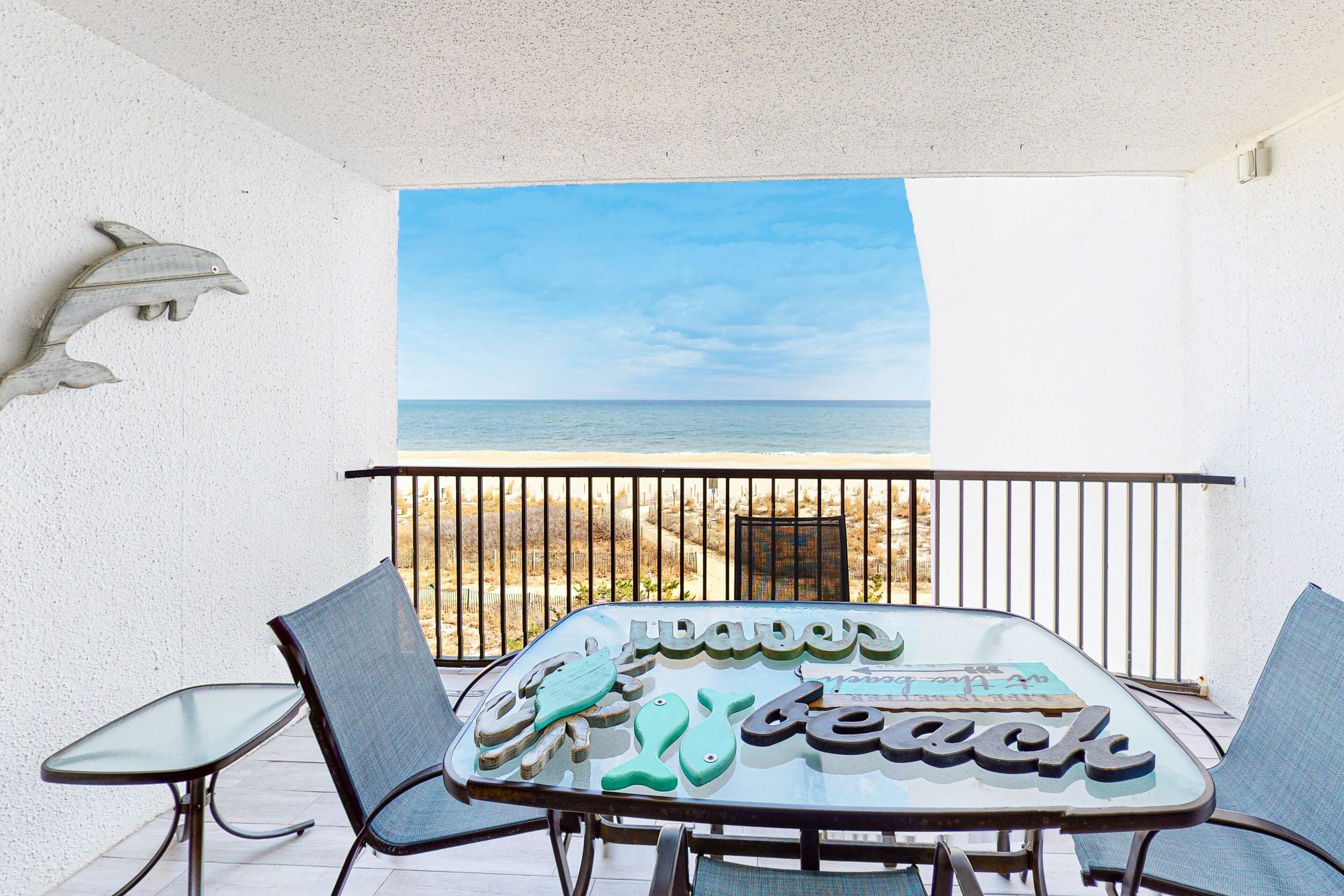 Oceanfront Condo with Shaded Balcony, WiFi, Laundry, AC & Shared Pool