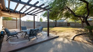 An outdoor patio with a pergola, seating area, and a view of the backyard. - Home in the Historic Coronado District 2bed,1 bath (Phoenix)