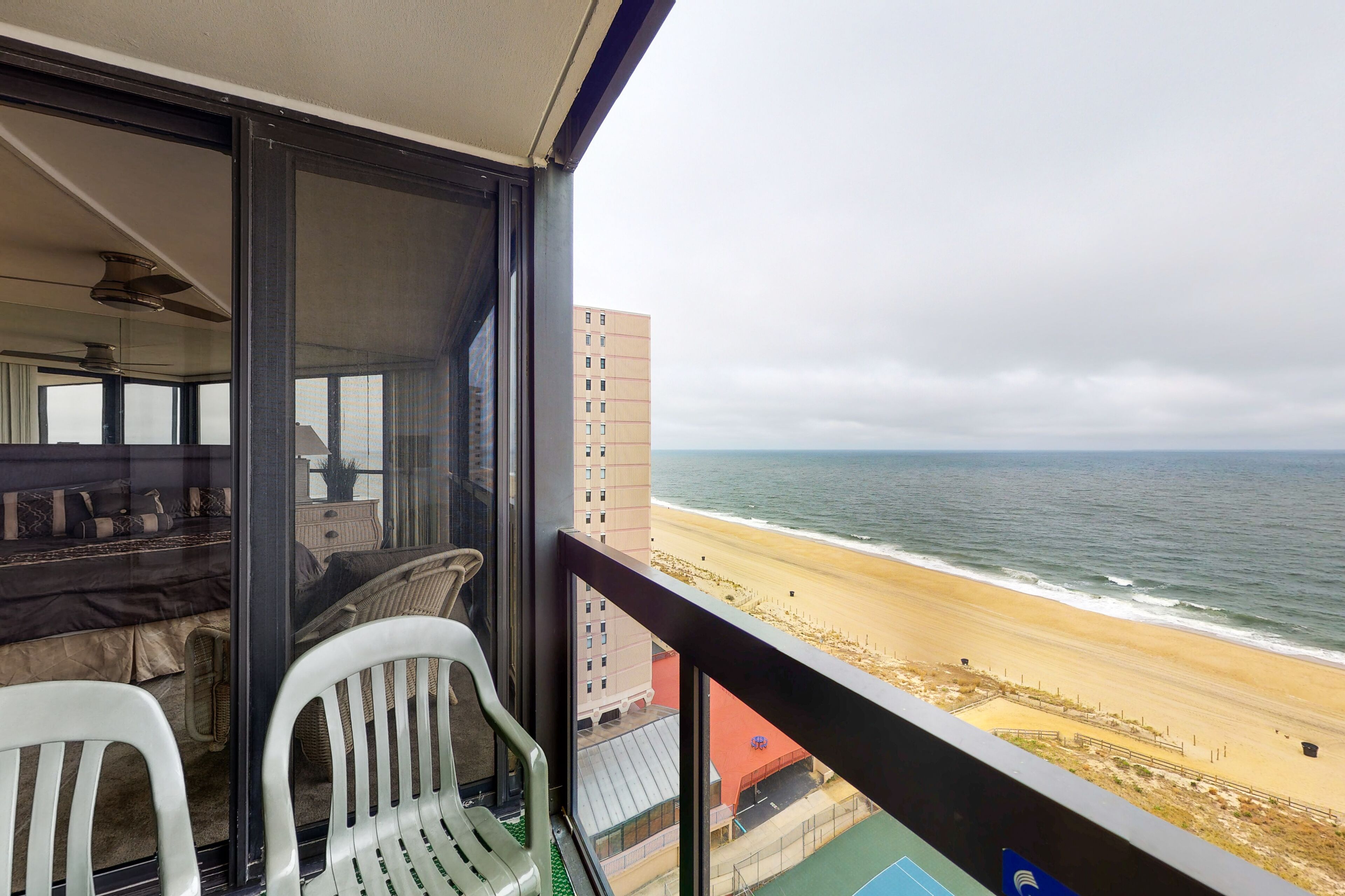 Waterfront condo with balcony, beach views, pools & gym