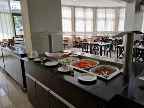 Enjoy a diverse spread of fresh fruits, vegetables, and prepared dishes at our buffet.