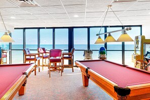 Enjoy a game of pool with ocean views from the pool room's large windows.
