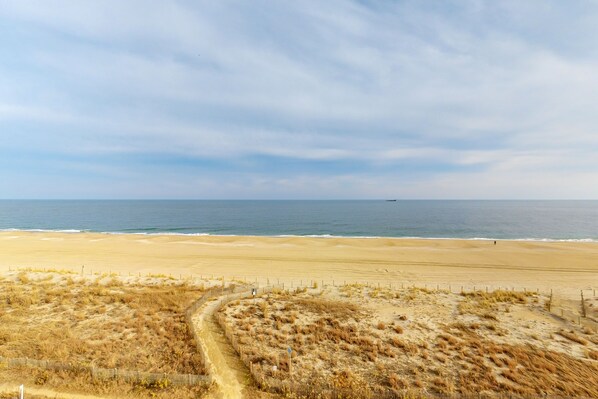 Stroll along the sandy beach and enjoy the ocean views.