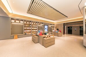 A modern, well-lit retail space with organized shelves and a central display area.