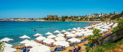 On the beach, sun-loungers, beach towels
