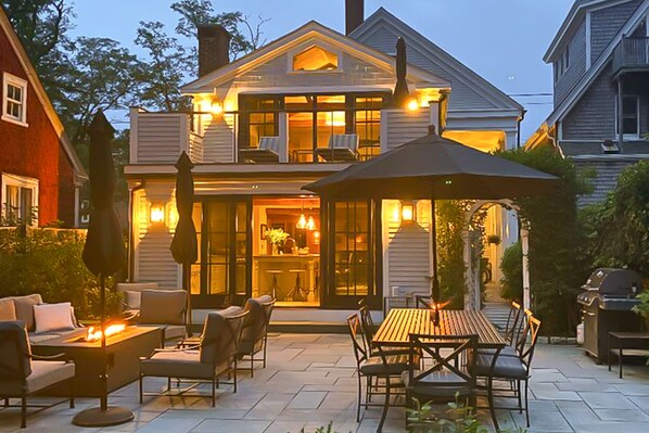 Relax in the welcoming entrance with a covered porch and patio area, perfect for outdoor relaxation.