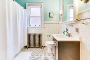 Bathtub, hair dryer, towels, soap