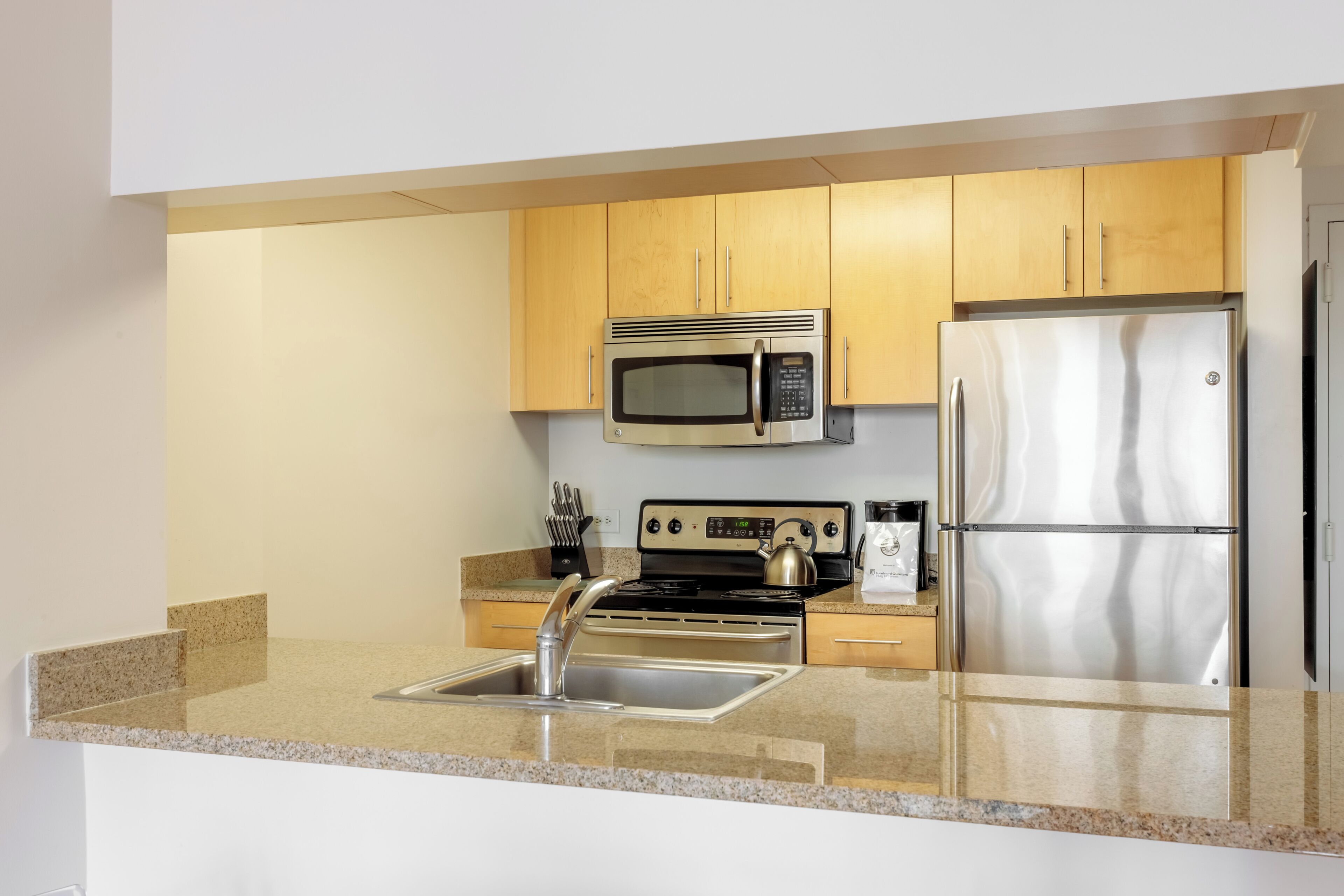 Coffee/tea maker, fridge, microwave, oven