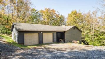 A single-story building with a garage and a small porch.