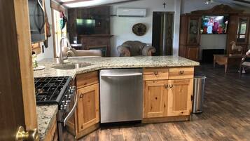 Microwave, dishwasher, coffee/tea maker, cookware/dishes/utensils