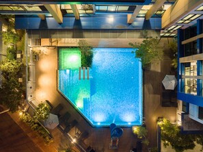 Outdoor pool, open 7:00 AM to 9:00 PM, pool umbrellas, sun loungers