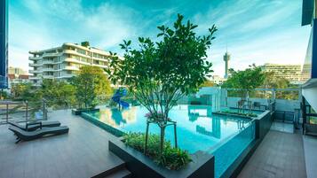 Outdoor pool, open 7:00 AM to 9:00 PM, pool umbrellas, sun loungers