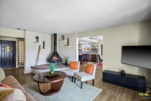 Smart TV, fireplace, books, offices