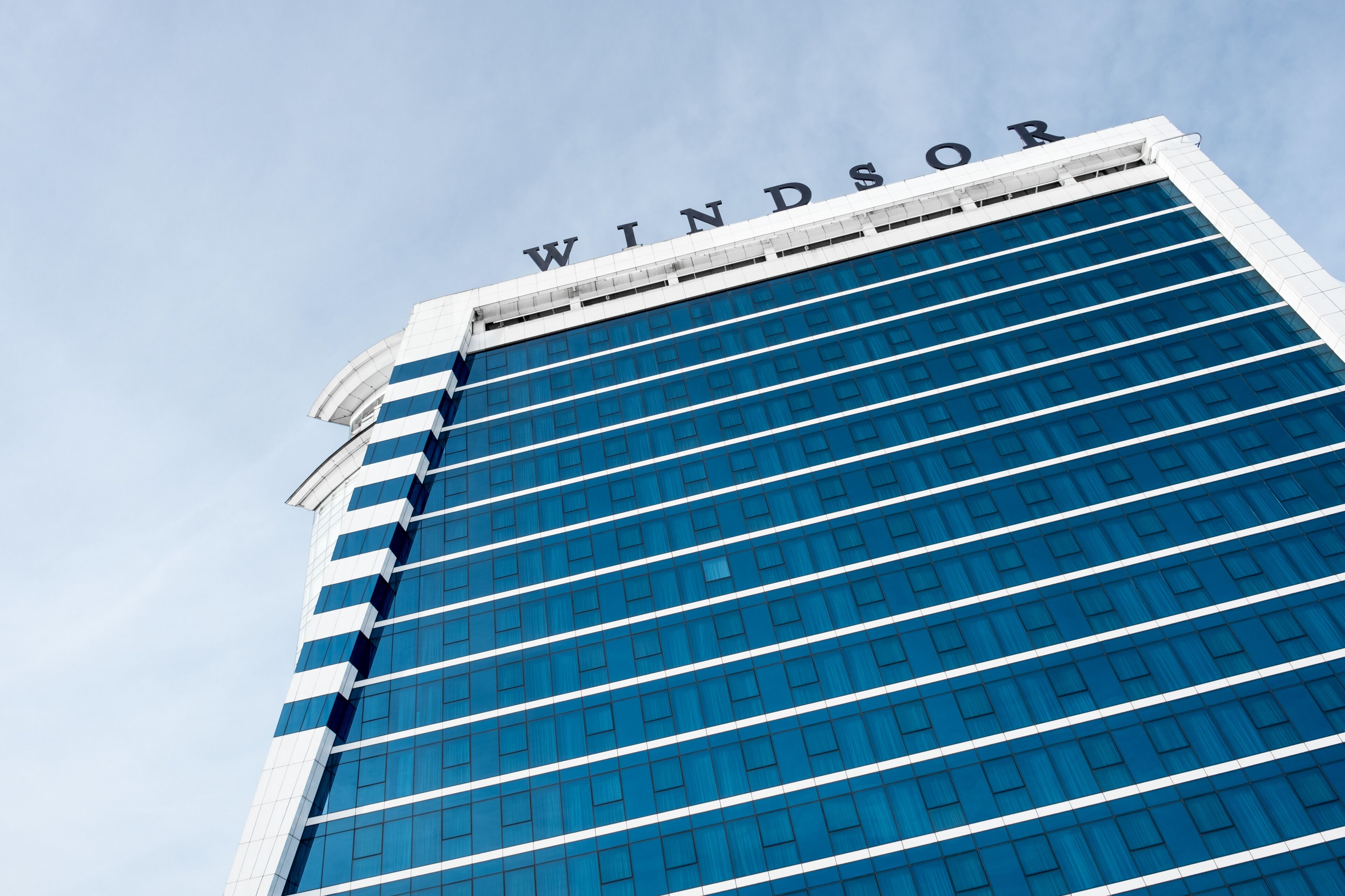 A tall building with the name "WINDSOR" at the top.