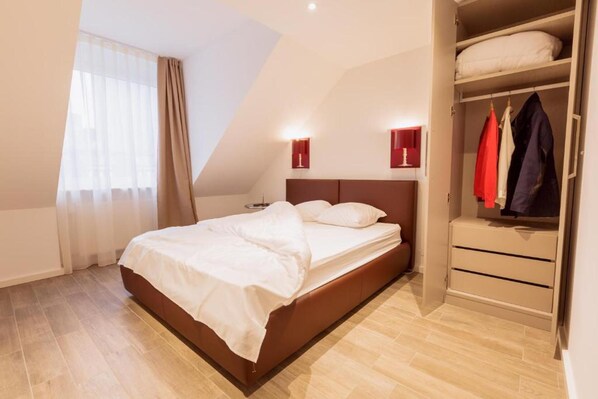 Appartement, 1 grand lit | 1 chambre, fer et planche à repasser, Wi-Fi gratuit, draps fournis