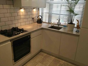 Appartement, Meerdere bedden | Privékeuken | Een koelkast, een microgolfoven, een oven, een kookplaat