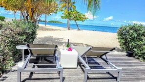 On the beach, sun-loungers, beach towels