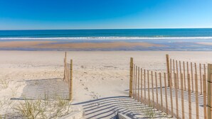 A beach with a wooden fence and a clear view of the ocean. - Sanderling - 4 bedroom, 2.5 Oceanfront Home in North Topsail Beach! (North Topsail Beach)