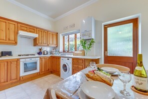 Fridge, microwave, oven, cookware/dishes/utensils