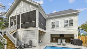 A two-story house with a covered patio, a swimming pool, and a fenced backyard. - Convenient Location to Beach & Downtown (Hilton Head Island)