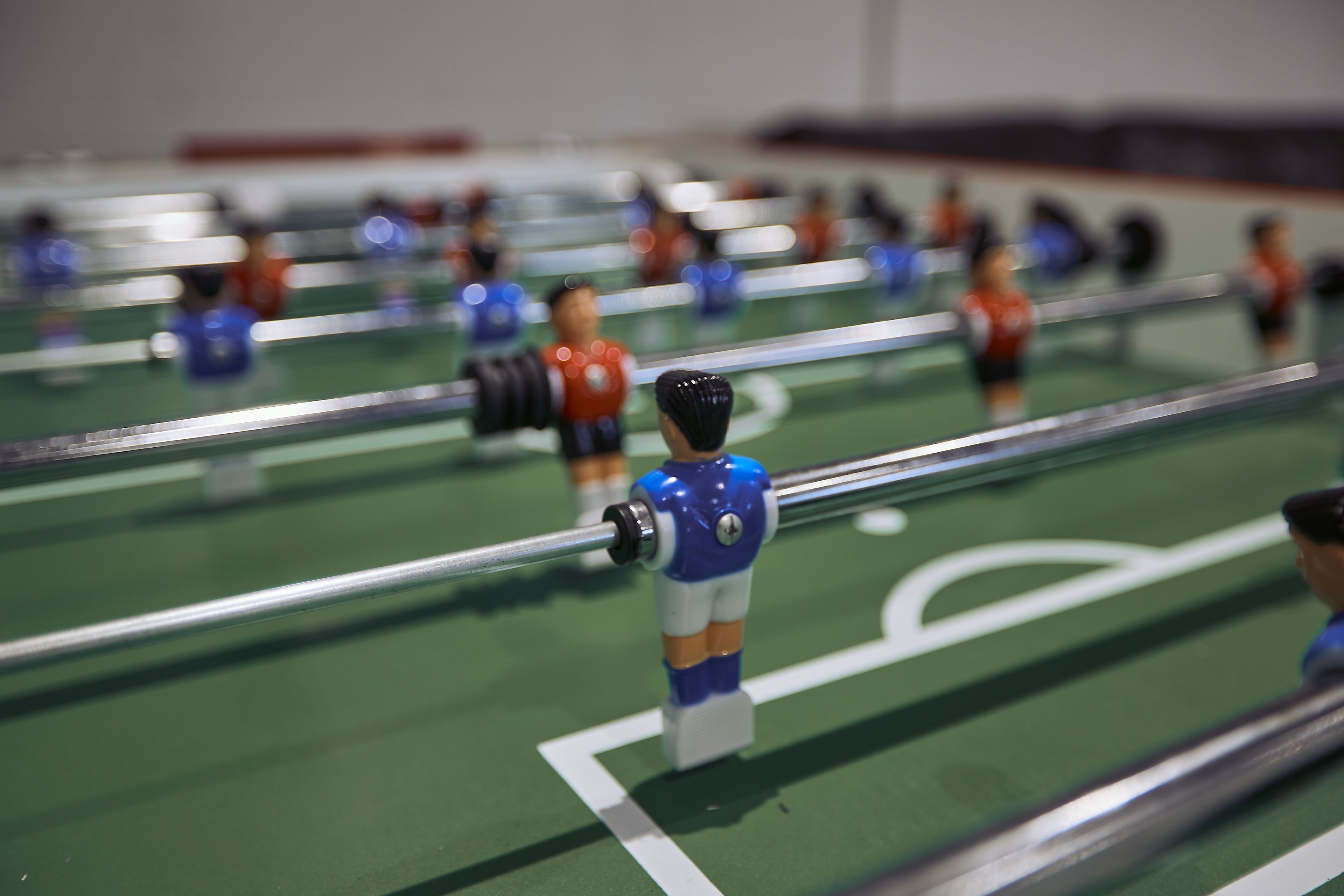 A tabletop game with miniature figures and a goal post.