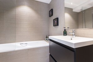 Bathtub, hair dryer, towels
