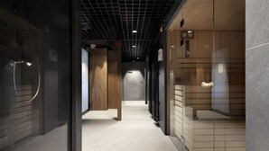 A modern hallway with a glass door on the left, a wooden door in the center, and a glass door on the right. - Elite Apartments Nadmotławie Prestige (Gdansk)