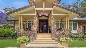 A two-story house with a stone facade, a covered porch, and a front door. - Brookfield Country House, Pool, 7 bedrooms (Upper Brookfield)