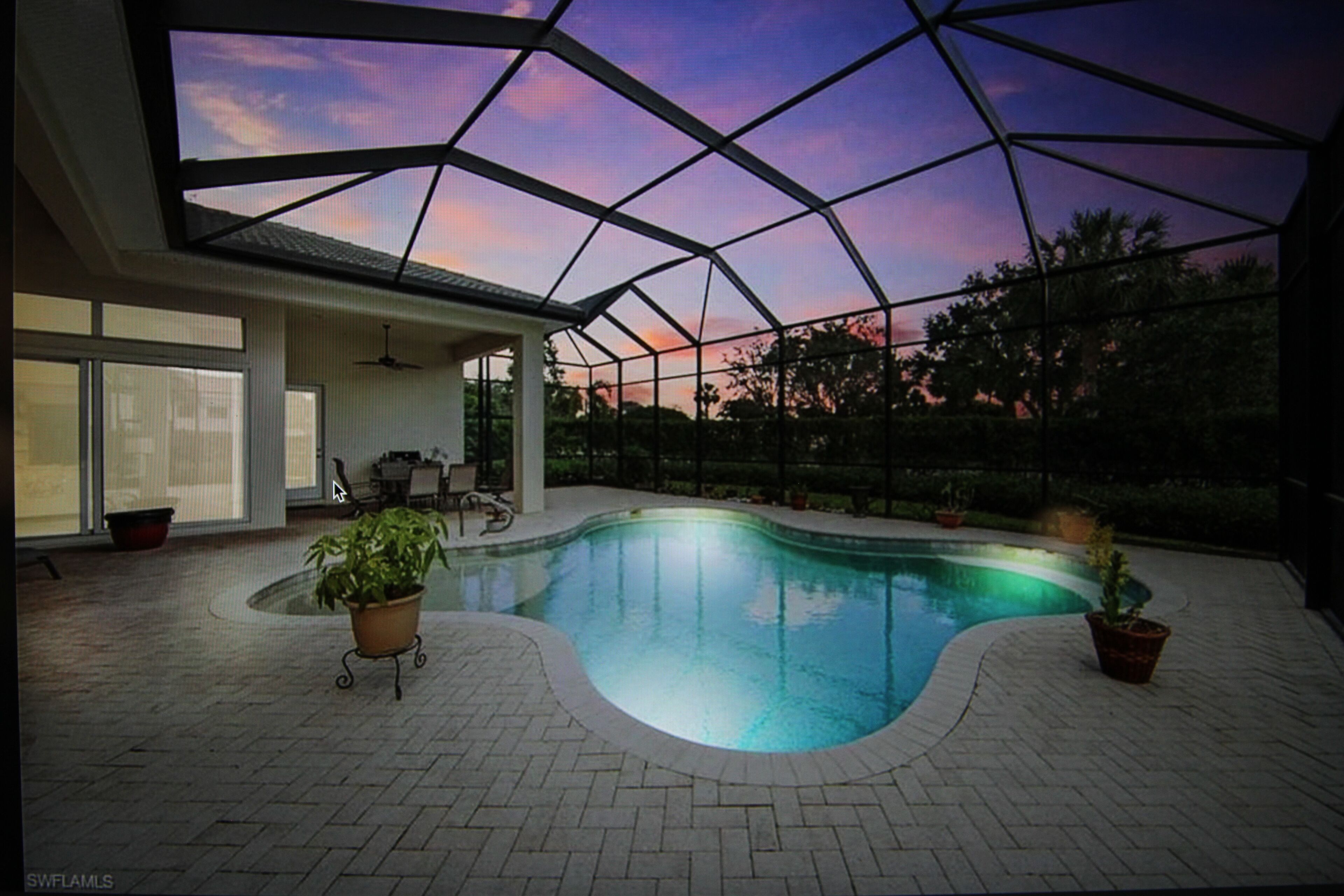 Beautiful one level 4 bedroom home, lanai with heated pool in a gated community.