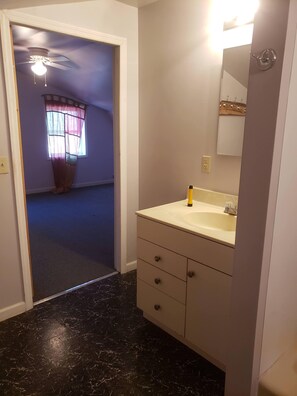 Combined shower/tub, hair dryer, towels, soap