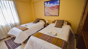 A hotel room with two beds, a painting on the wall, and a window with curtains. - Friendly and comfortable apartment in Cusco (cusco)