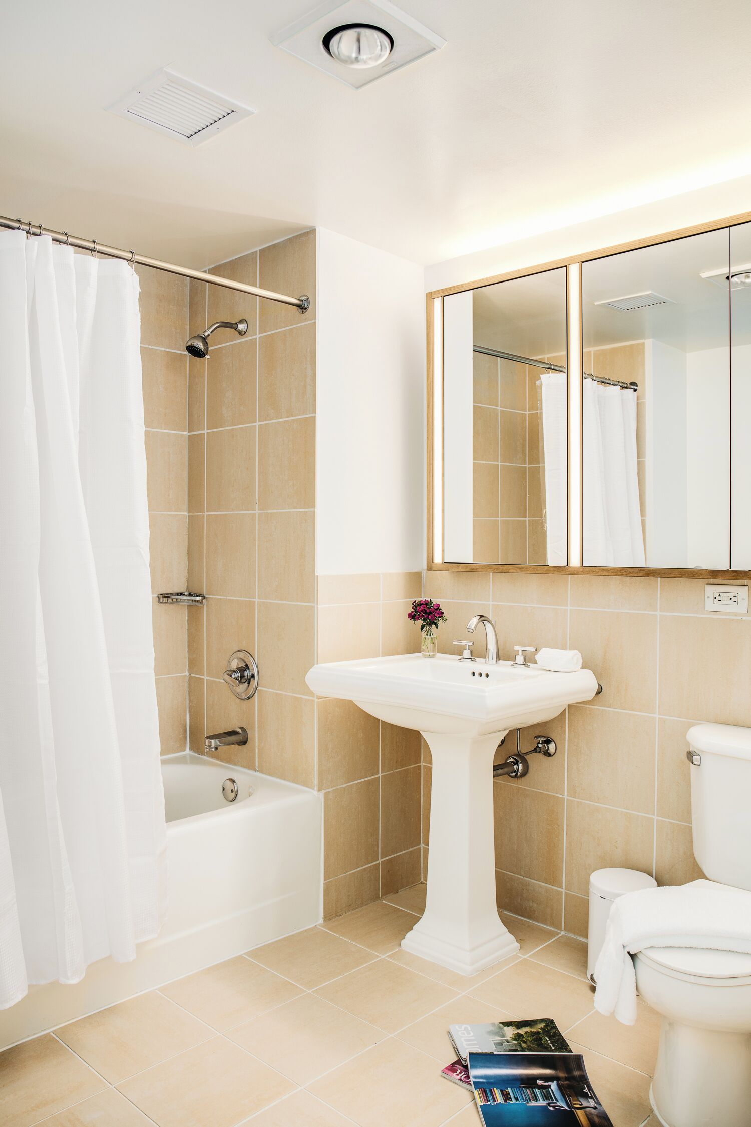 A bathroom with a bathtub, a sink, and a toilet.