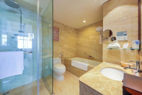 A modern bathroom with a glass shower enclosure, a white toilet, a bathtub, and a vanity with a sink and mirror. - Zhengzhou GDH Hotel (Zhengzhou)