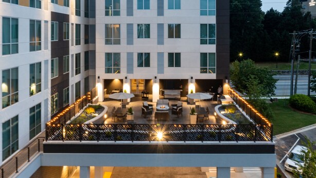 A hotel with a rooftop patio area featuring outdoor seating and ambient lighting. - Residence Inn by Marriott Decatur Emory Area (Decatur)