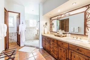Combined shower/bathtub, hair dryer, soap, toilet paper