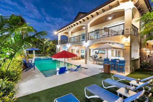 5 bedrooms, pool/spa heated, bikes, kayaks, game room, elevator, deep 75' dock.