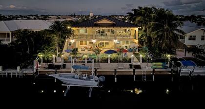 5 bedrooms, pool/spa heated, bikes, kayaks, game room, elevator, deep 75' dock.